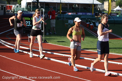 Miranda Melville,  Susan Randall, L'eerin Voss, and Erin Taylor completing two laps on the track at the Women's 20K Race Walk Nationals